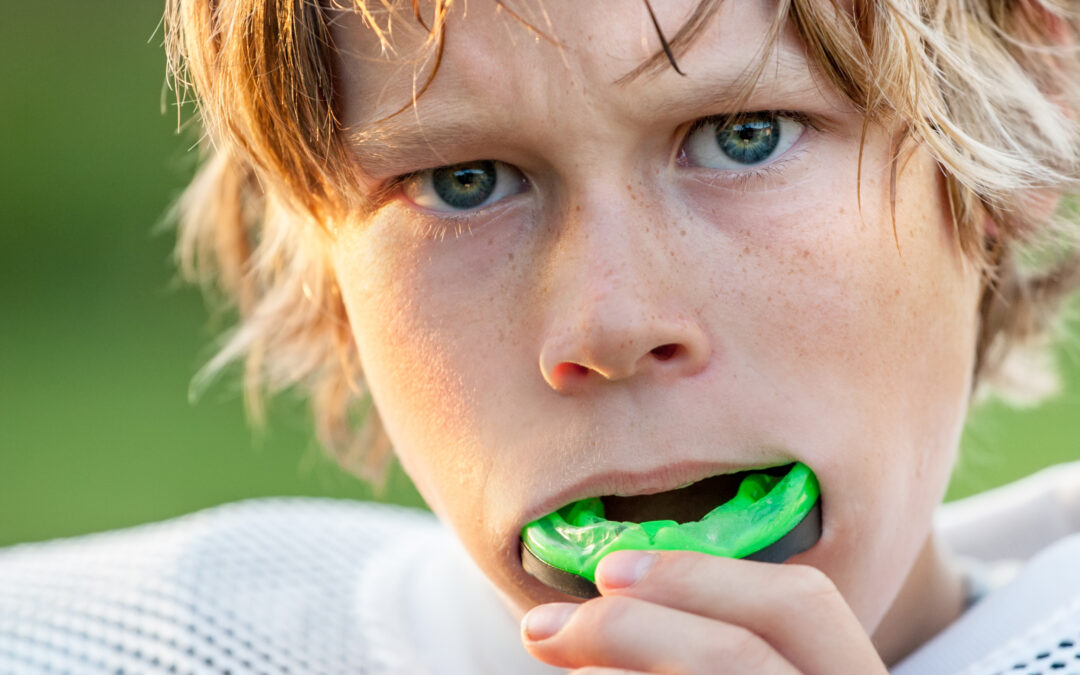 boy wearing mouthguard during contact sports